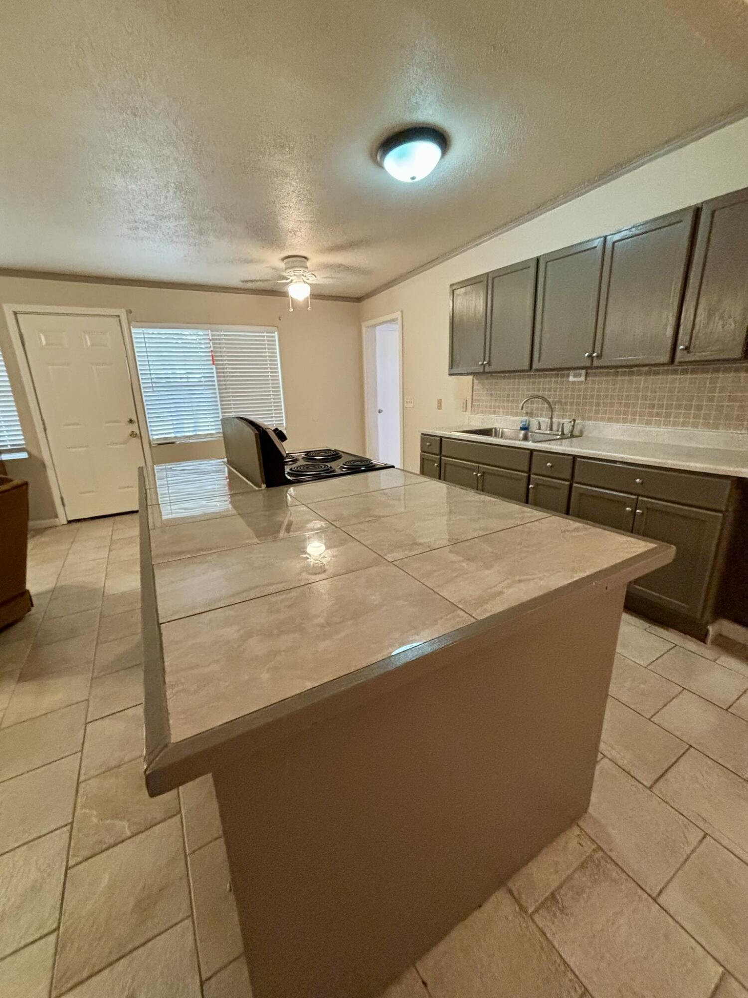 2313 47th Street Lubbock, TX 79412 - Photo 4 of 17 a room with pool table and windows