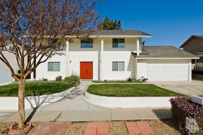 2973 Fitzgerald Road Simi Valley, CA 93065 - Photo 1 of 19 a front view of a house with a yard and garage