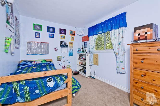2973 Fitzgerald Road Simi Valley, CA 93065 - Photo 12 of 19 a bedroom with a bed and a window