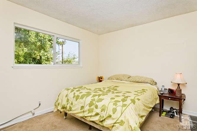 2973 Fitzgerald Road Simi Valley, CA 93065 - Photo 14 of 19 a bedroom with a bed and a window