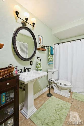 2973 Fitzgerald Road Simi Valley, CA 93065 - Photo 15 of 19 a bathroom with a sink and a mirror