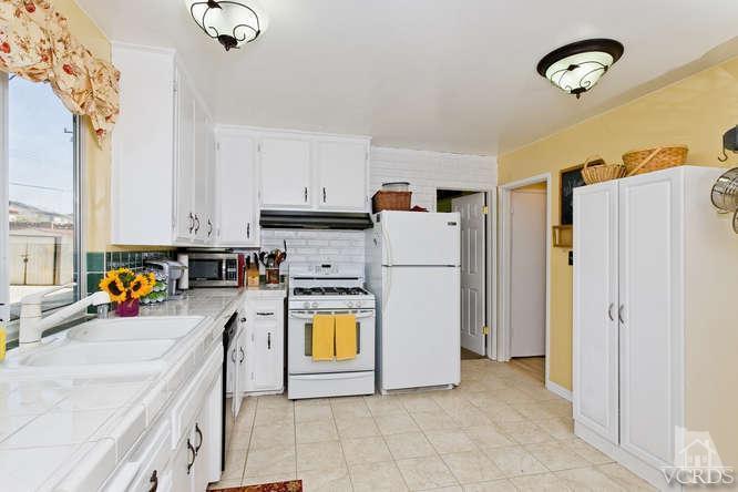 2973 Fitzgerald Road Simi Valley, CA 93065 - Photo 8 of 19 a view of a kitchen with sink and refrigerator
