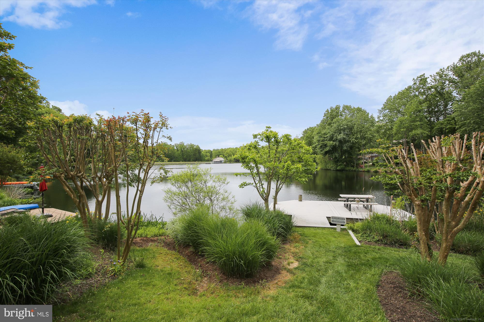 1559 Autumn Ridge Circle Reston, VA 20194 - Photo 54 of 60 a view of a lake with houses in the back