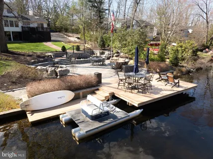 a view of a backyard with sitting area