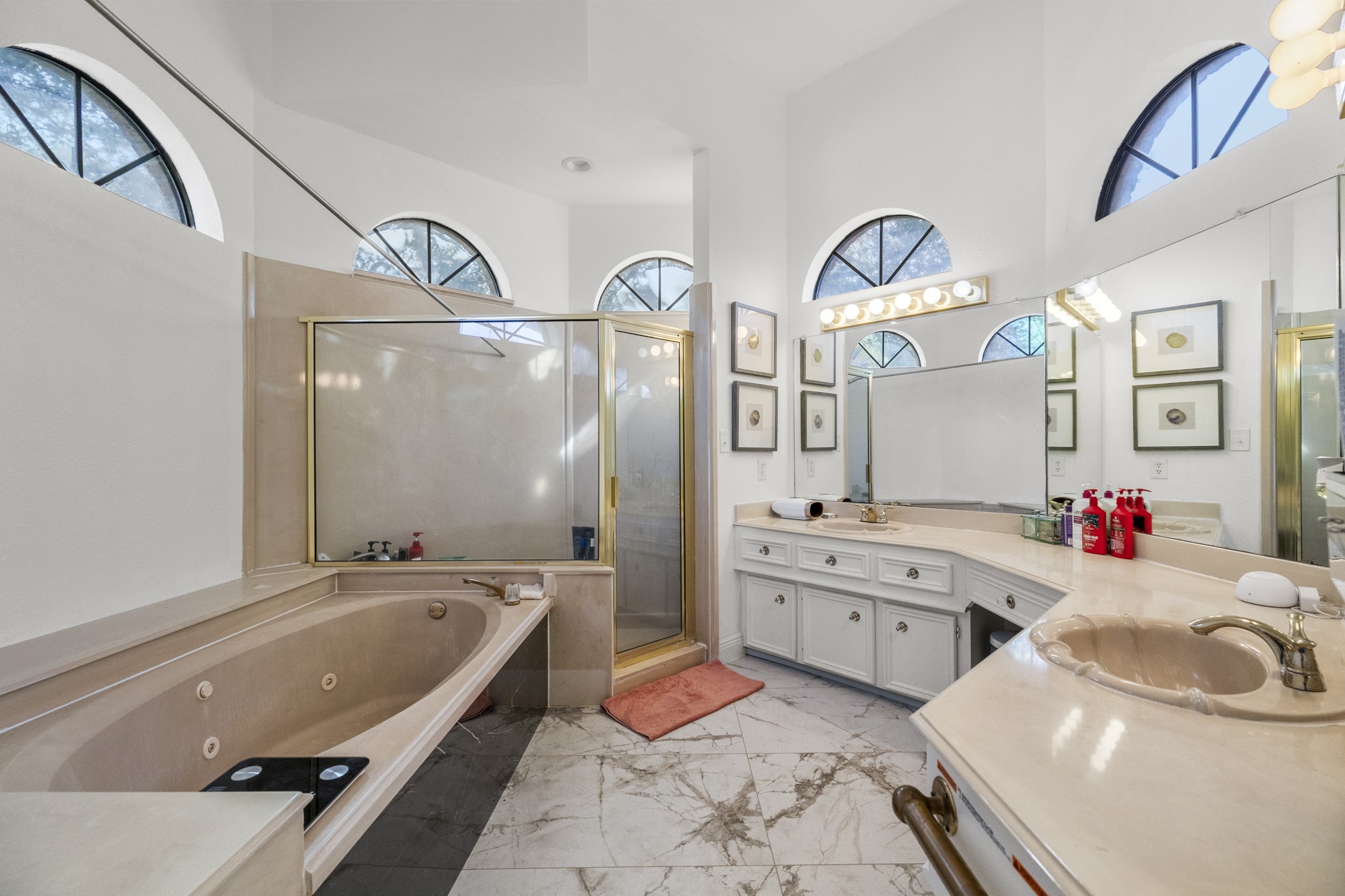 5107 Waterbeck Street Fulshear, TX 77441 - Photo 11 of 30 a bathroom with a tub sink and mirror