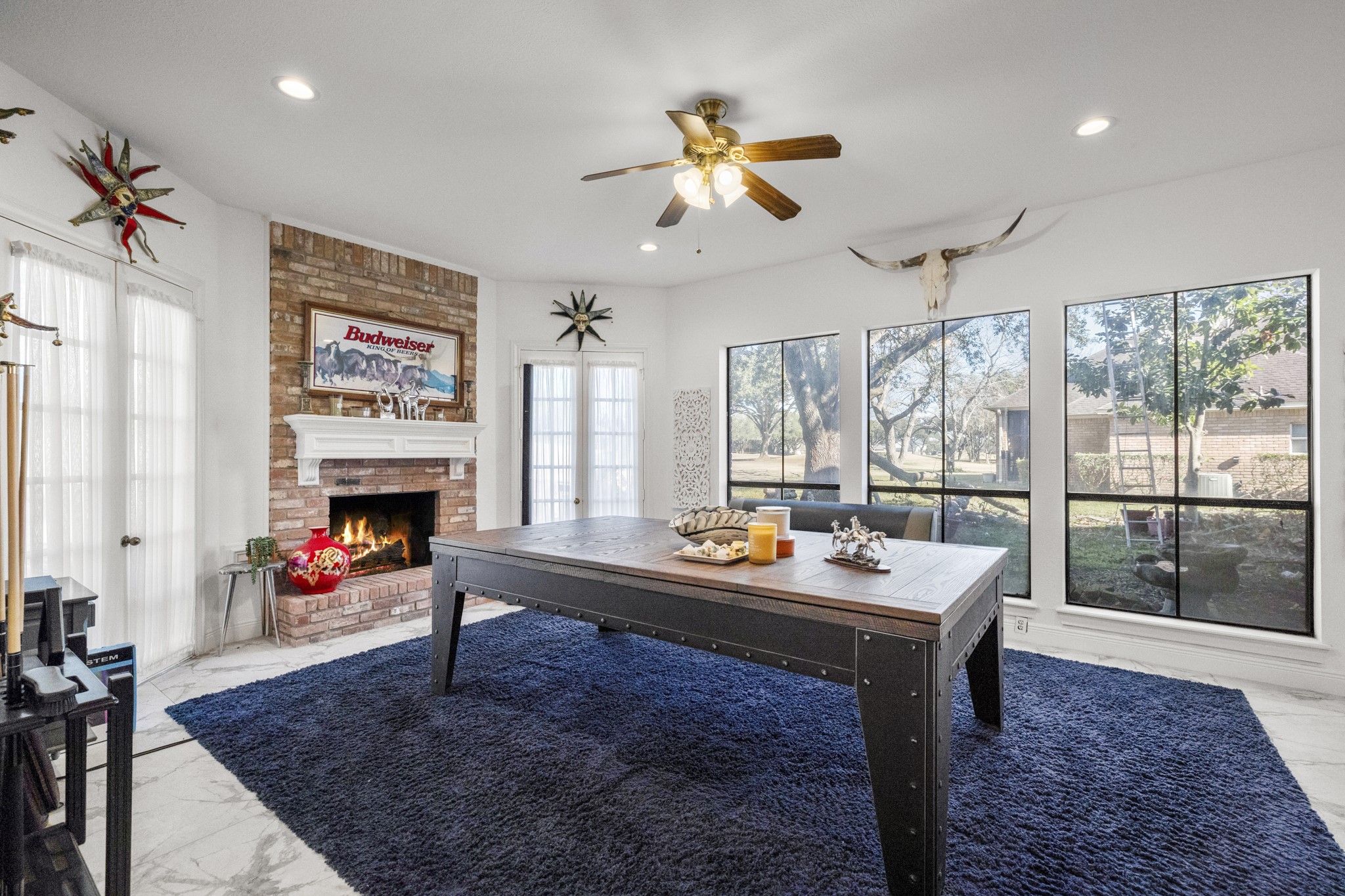 5107 Waterbeck Street Fulshear, TX 77441 - Photo 20 of 30 a work room with furniture and a fireplace