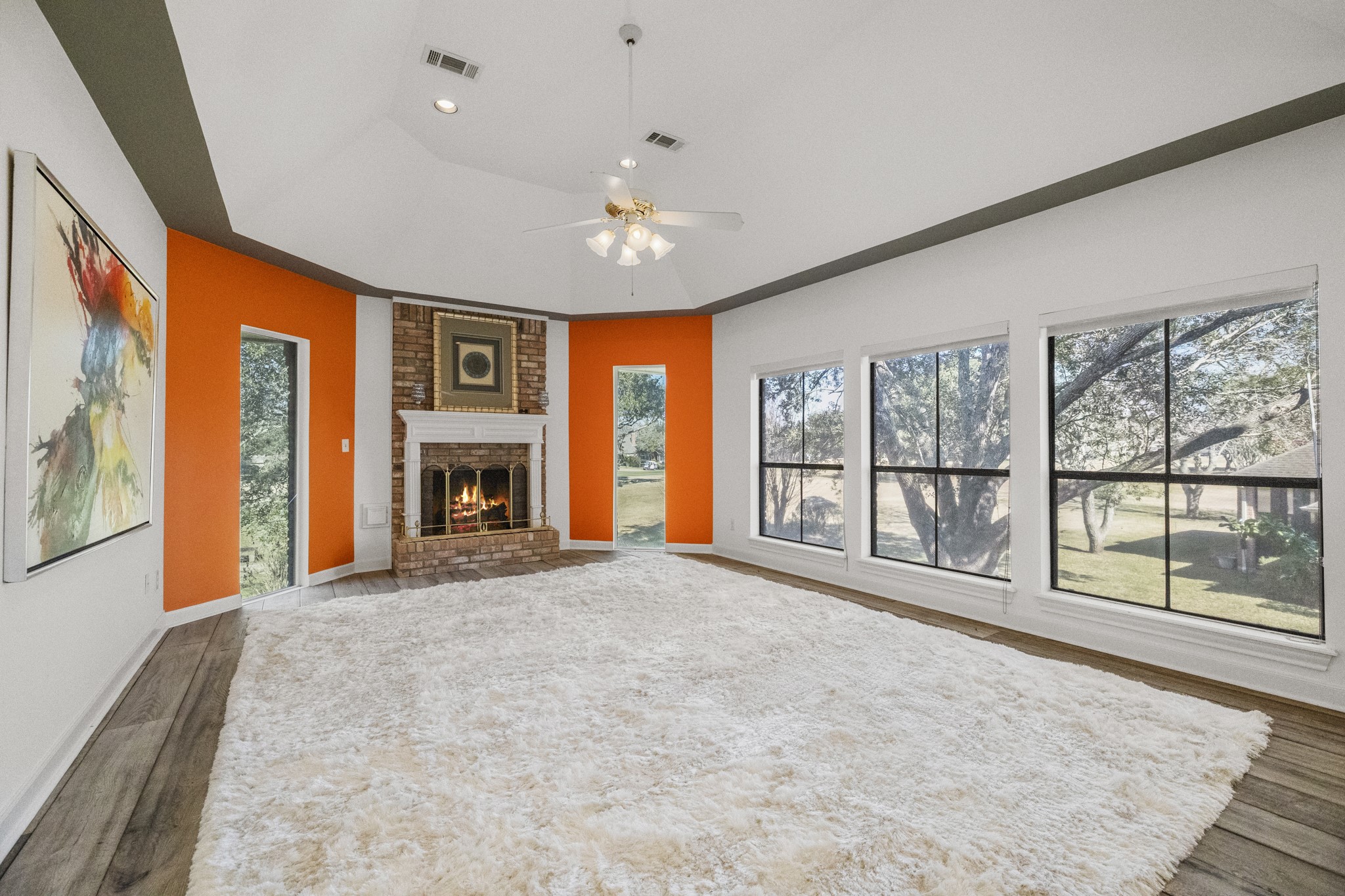 5107 Waterbeck Street Fulshear, TX 77441 - Photo 25 of 30 a big room with windows and fireplace