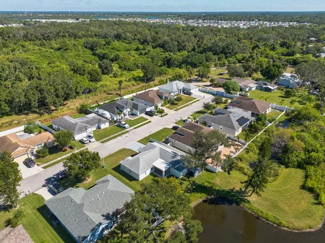 an aerial view of residential houses with outdoor space