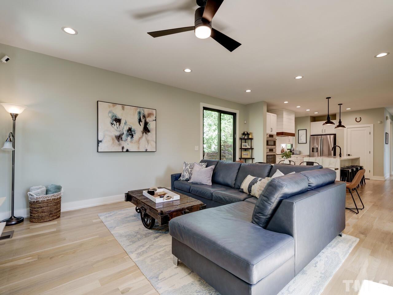 220 Hargrove Street Durham, NC 27701 - Photo 15 of 76 a living room with lots of furniture and kitchen view
