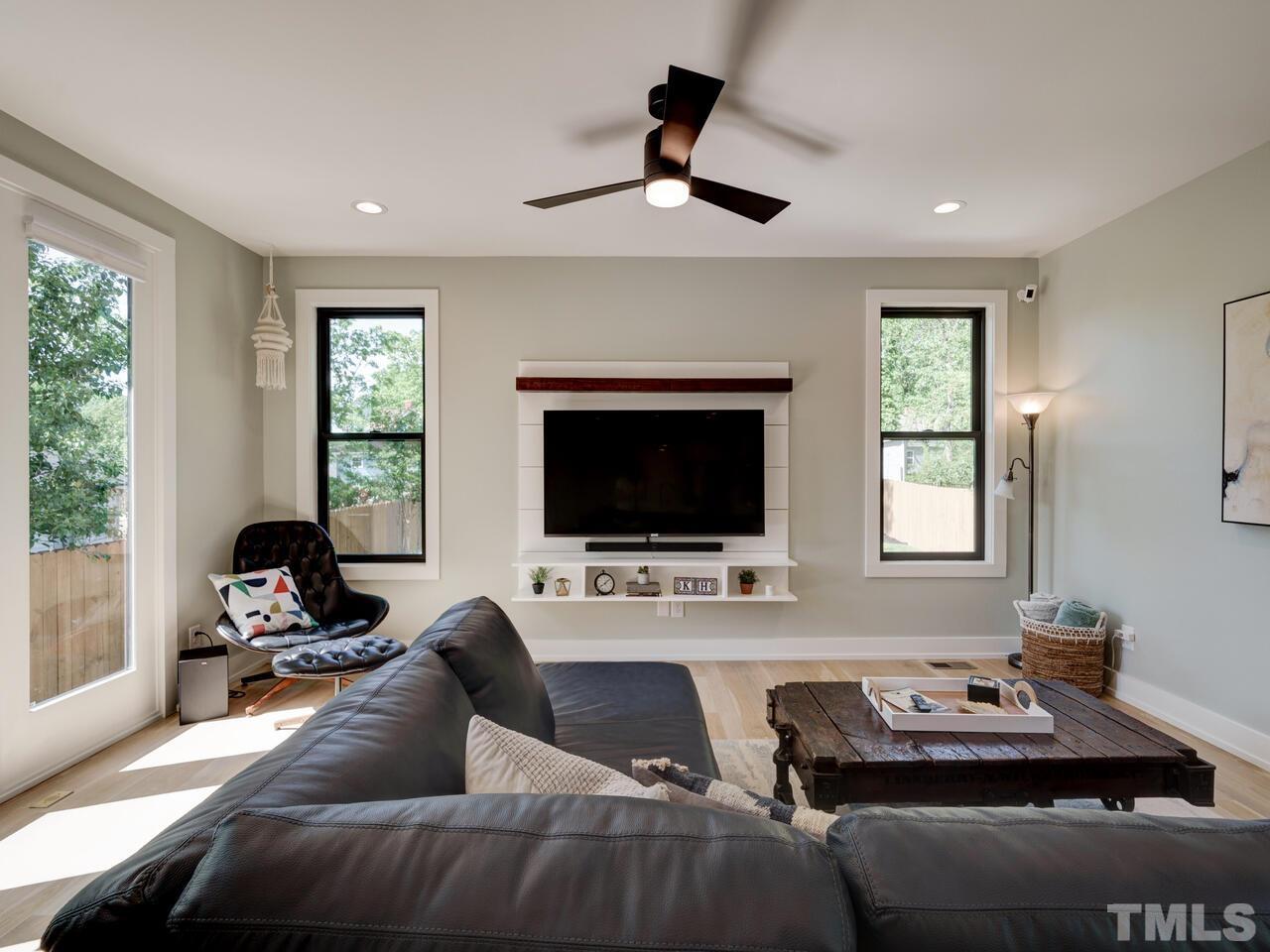 220 Hargrove Street Durham, NC 27701 - Photo 16 of 76 a living room with furniture and a flat screen tv