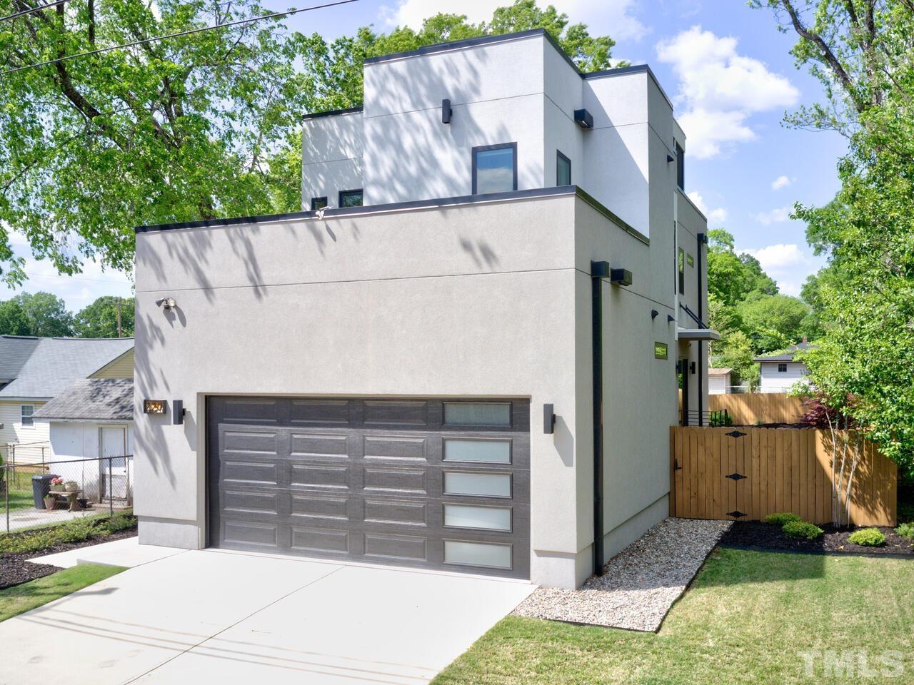 220 Hargrove Street Durham, NC 27701 - Photo 3 of 76 a front view of a house with a yard