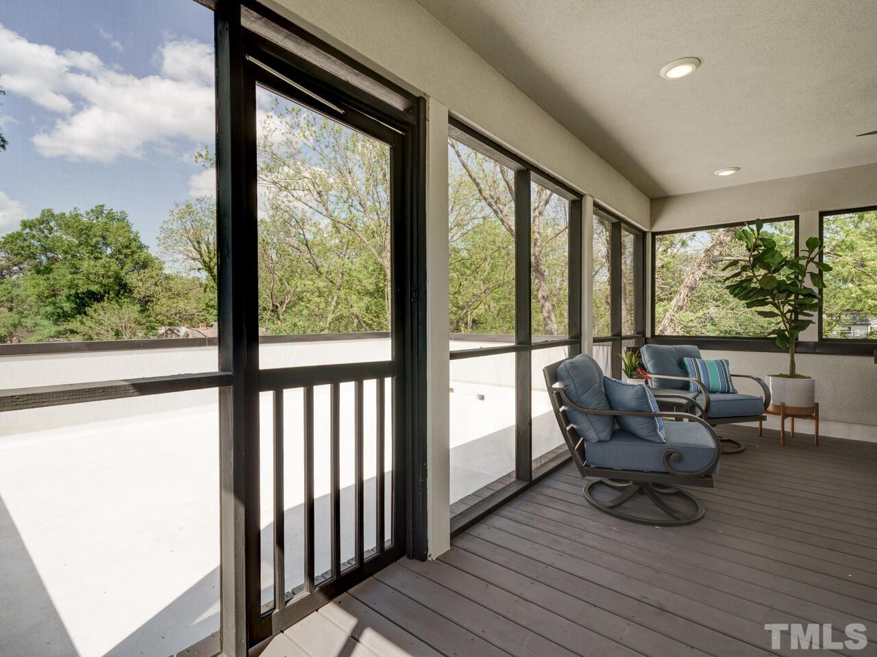 220 Hargrove Street Durham, NC 27701 - Photo 48 of 76 a living room with large windows and wooden floor