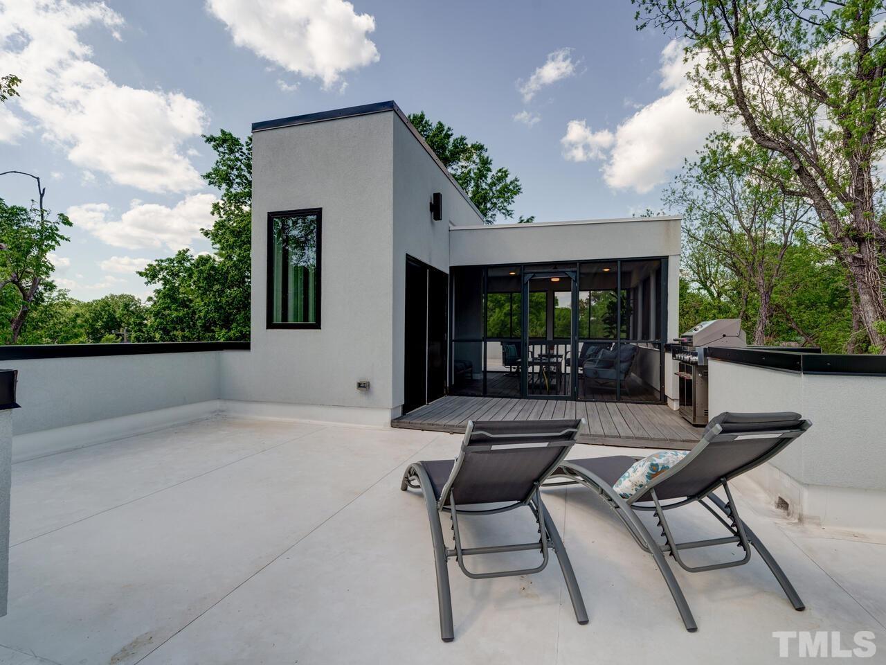 220 Hargrove Street Durham, NC 27701 - Photo 53 of 76 a view of house with backyard and outdoor seating
