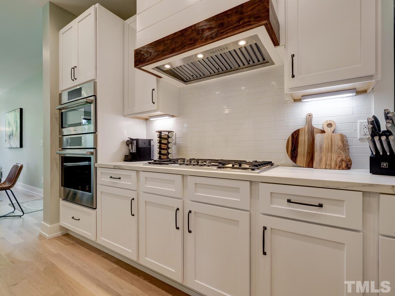 220 Hargrove Street Durham, NC 27701 - Photo 6 of 76 a kitchen with stainless steel appliances a sink and cabinets