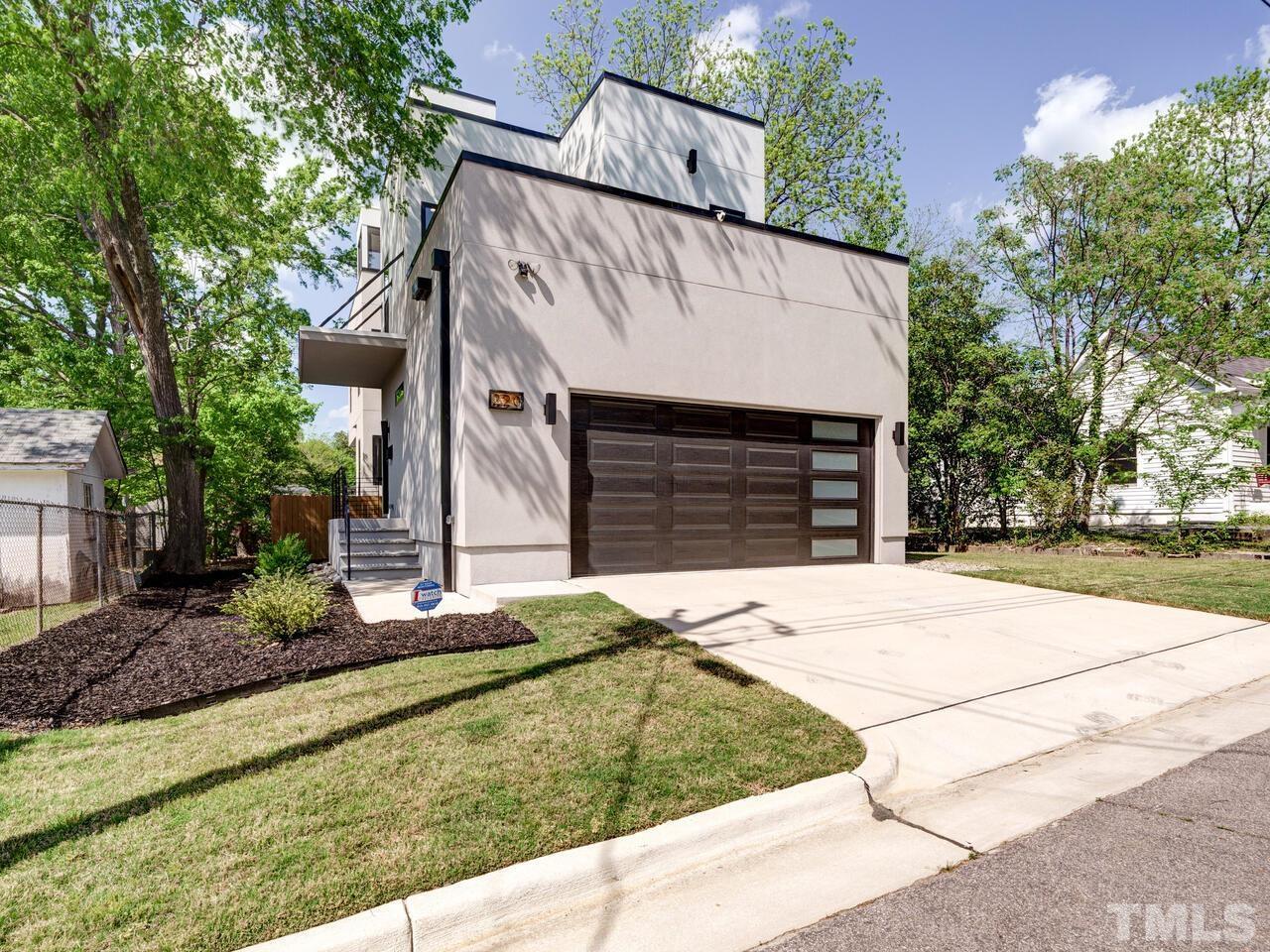 220 Hargrove Street Durham, NC 27701 - Photo 66 of 76 a front view of a house with garden