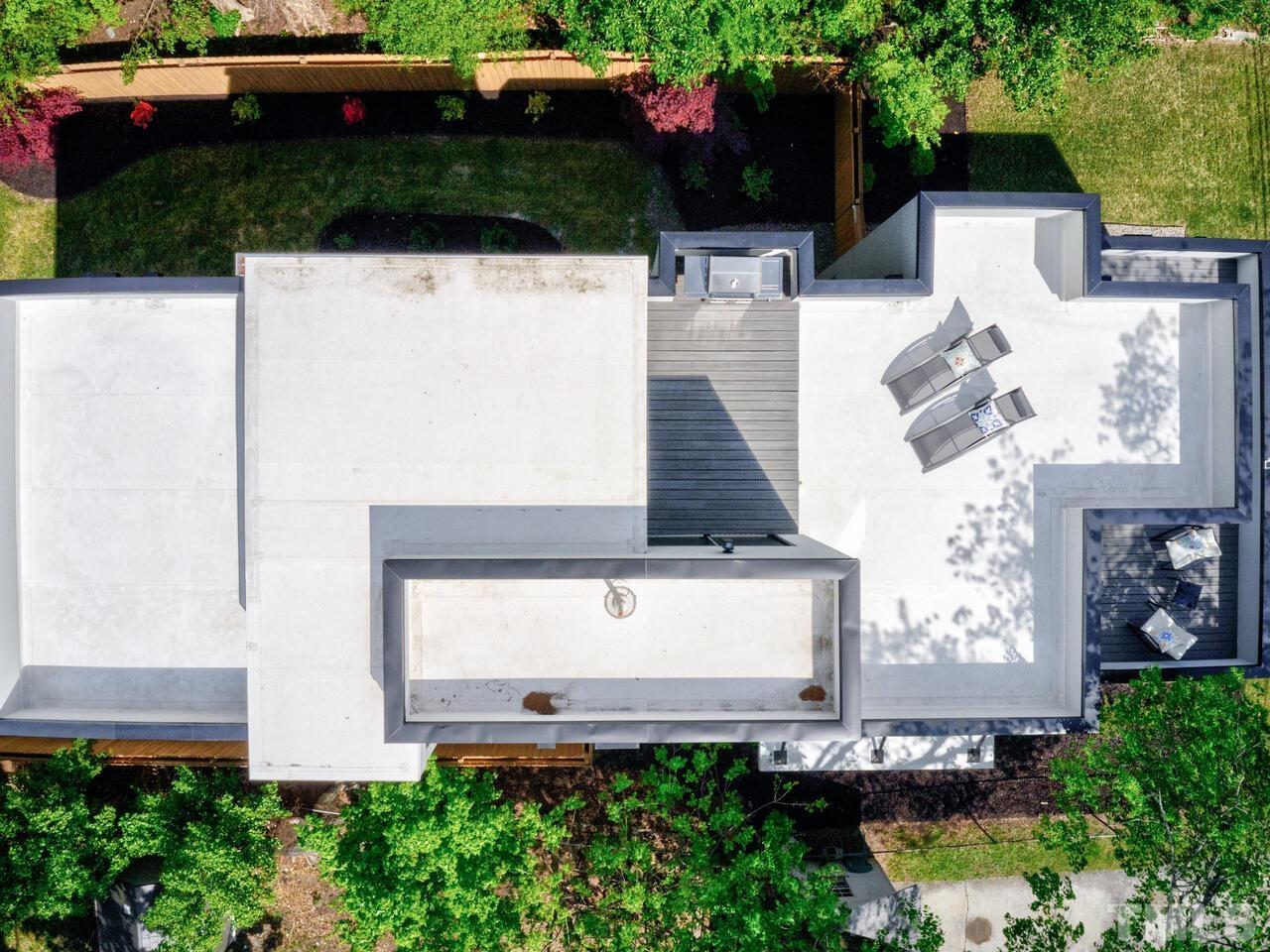 220 Hargrove Street Durham, NC 27701 - Photo 74 of 76 an aerial view of a house with a yard and potted plants