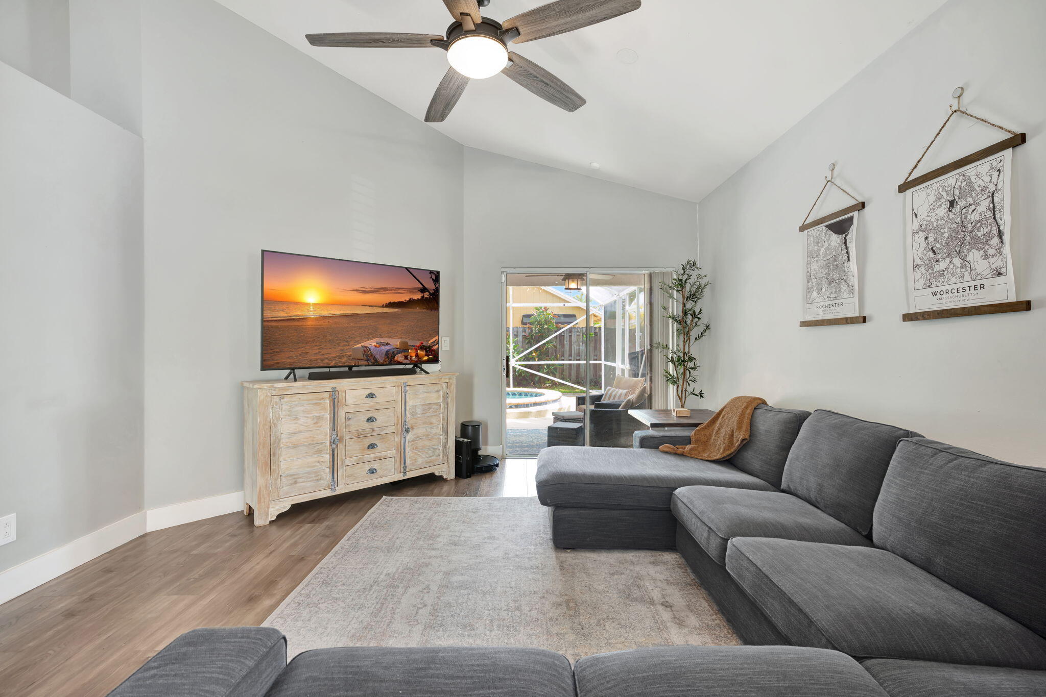 6247 Ungerer Street Jupiter, FL 33458 - Photo 13 of 36 a living room with furniture and a flat screen tv