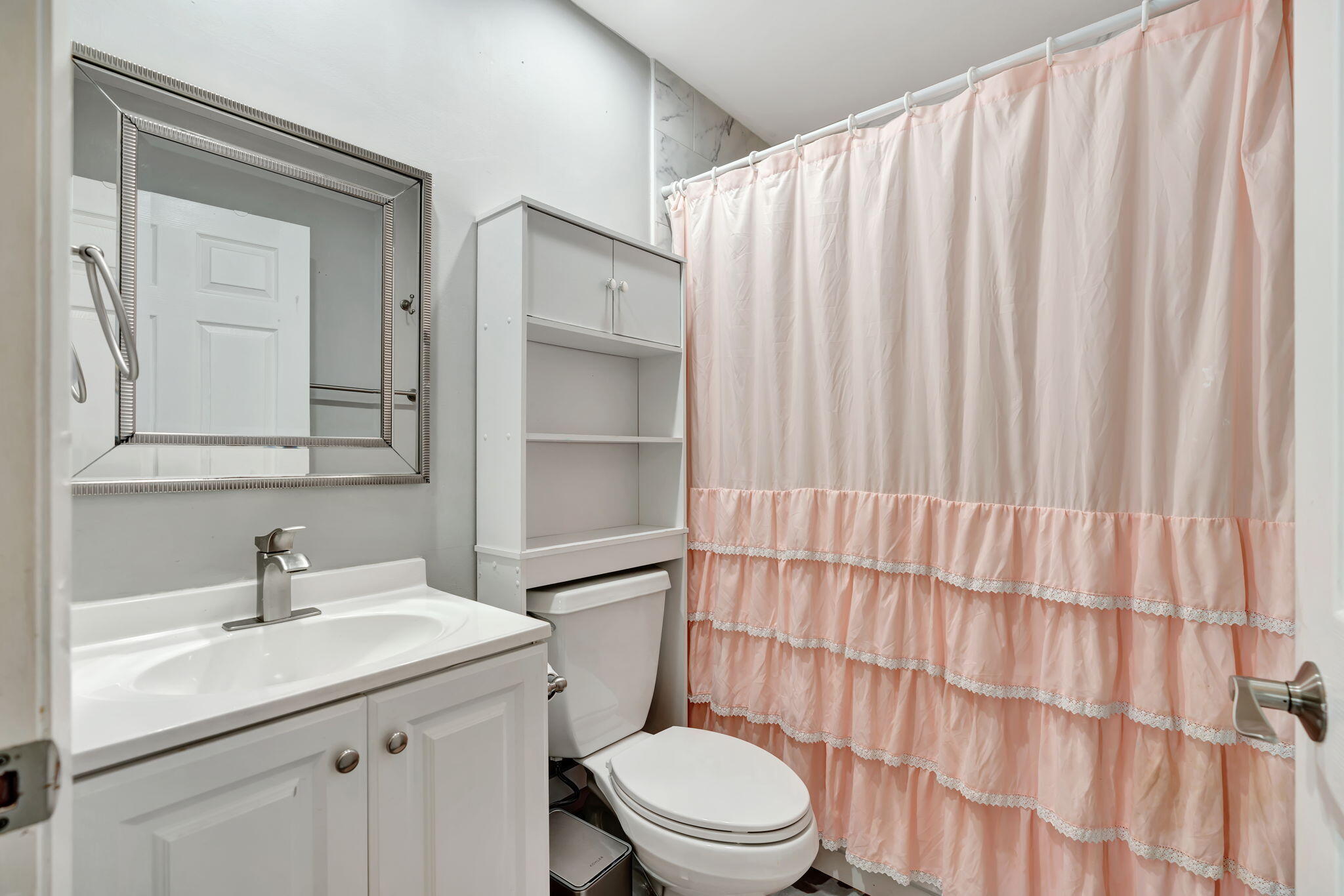 6247 Ungerer Street Jupiter, FL 33458 - Photo 23 of 36 a bathroom with a sink a toilet and shower