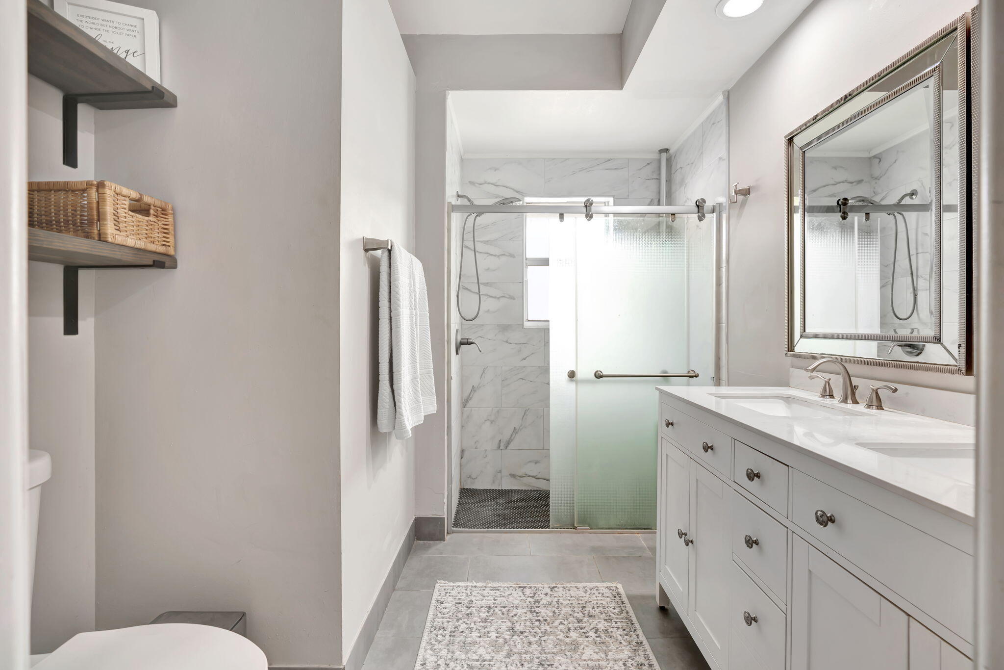 6247 Ungerer Street Jupiter, FL 33458 - Photo 29 of 36 a bathroom with a granite countertop sink toilet and shower