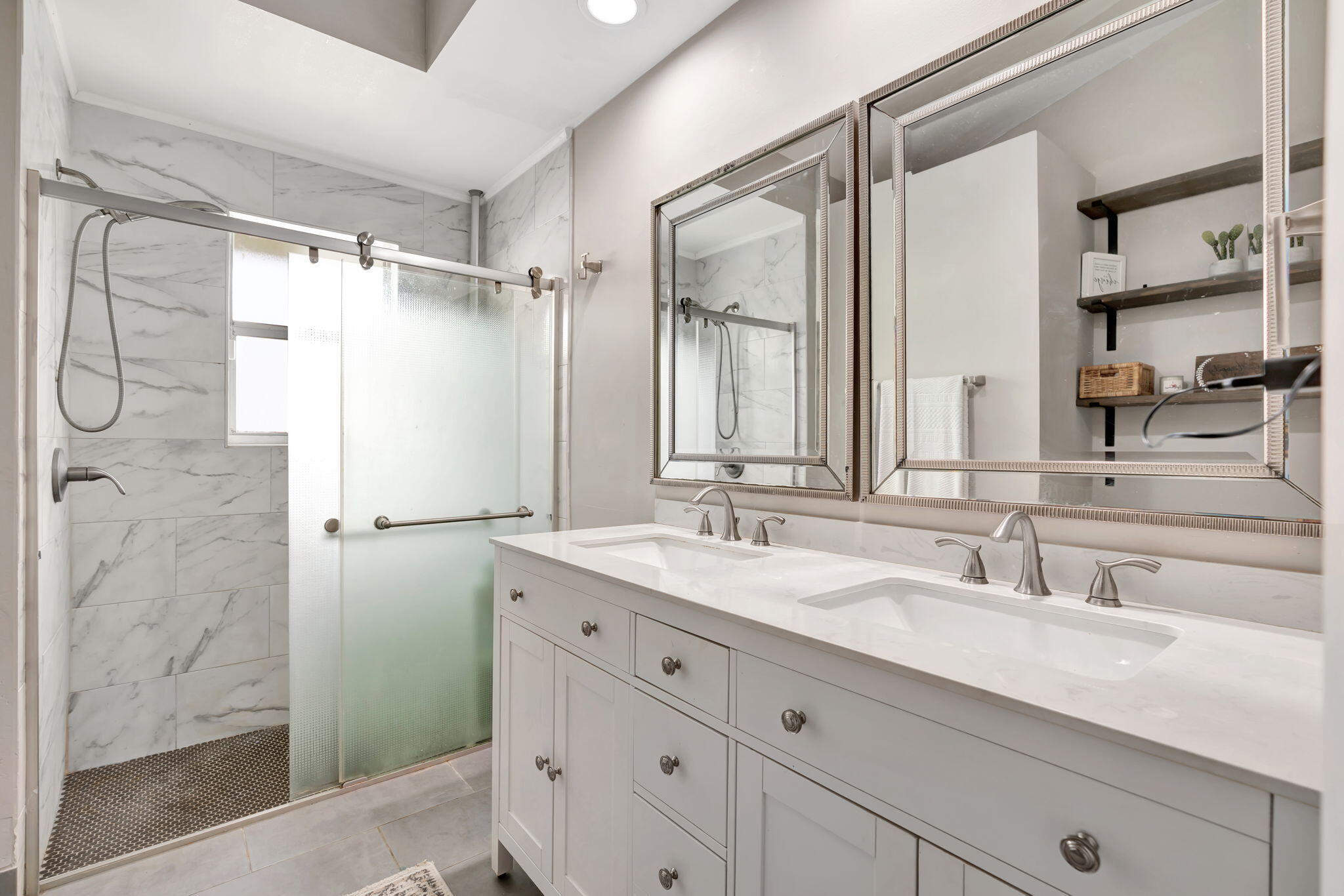 6247 Ungerer Street Jupiter, FL 33458 - Photo 30 of 36 a bathroom with a double vanity sink mirror and double