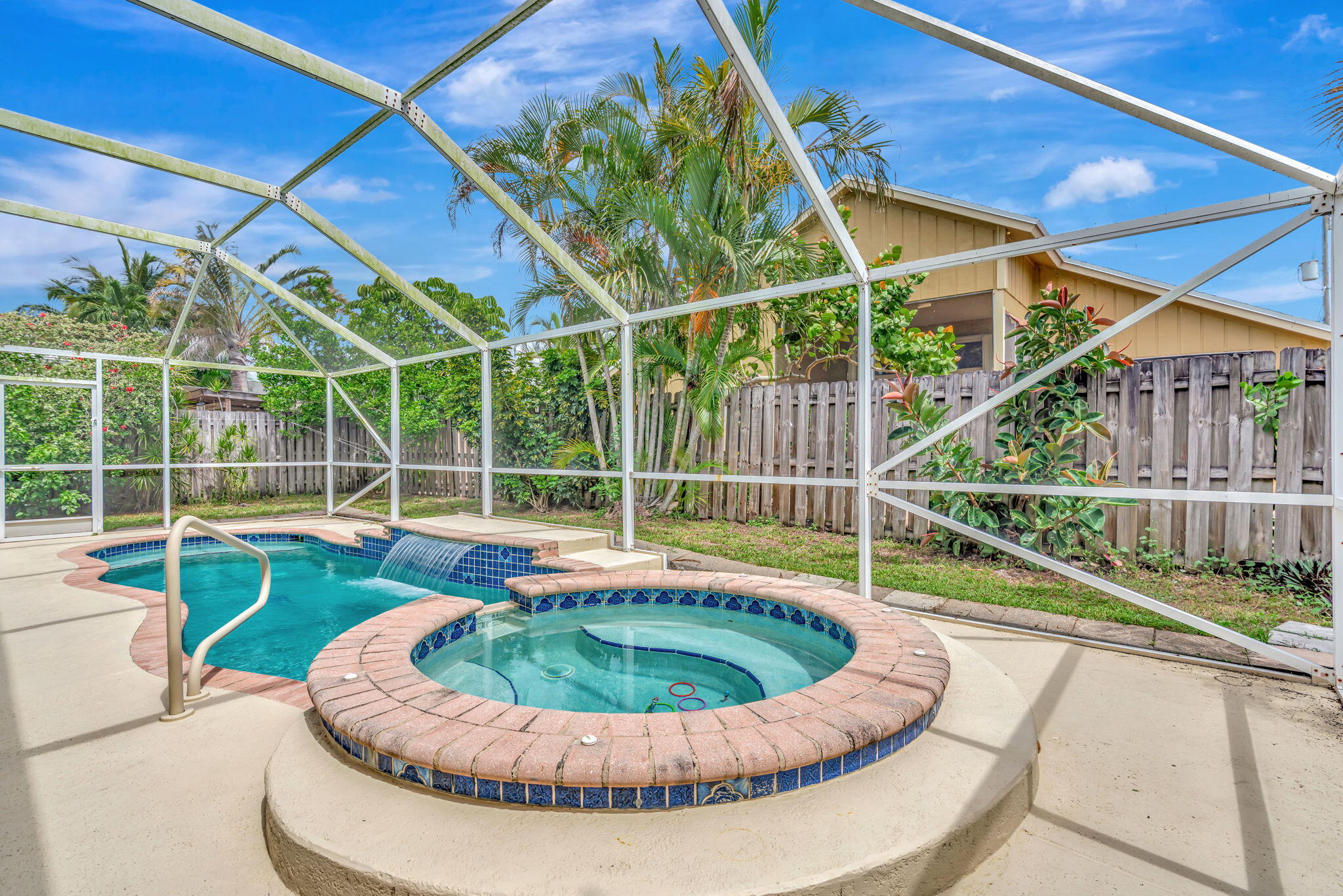 6247 Ungerer Street Jupiter, FL 33458 - Photo 32 of 36 a view of a swimming pool with a porch