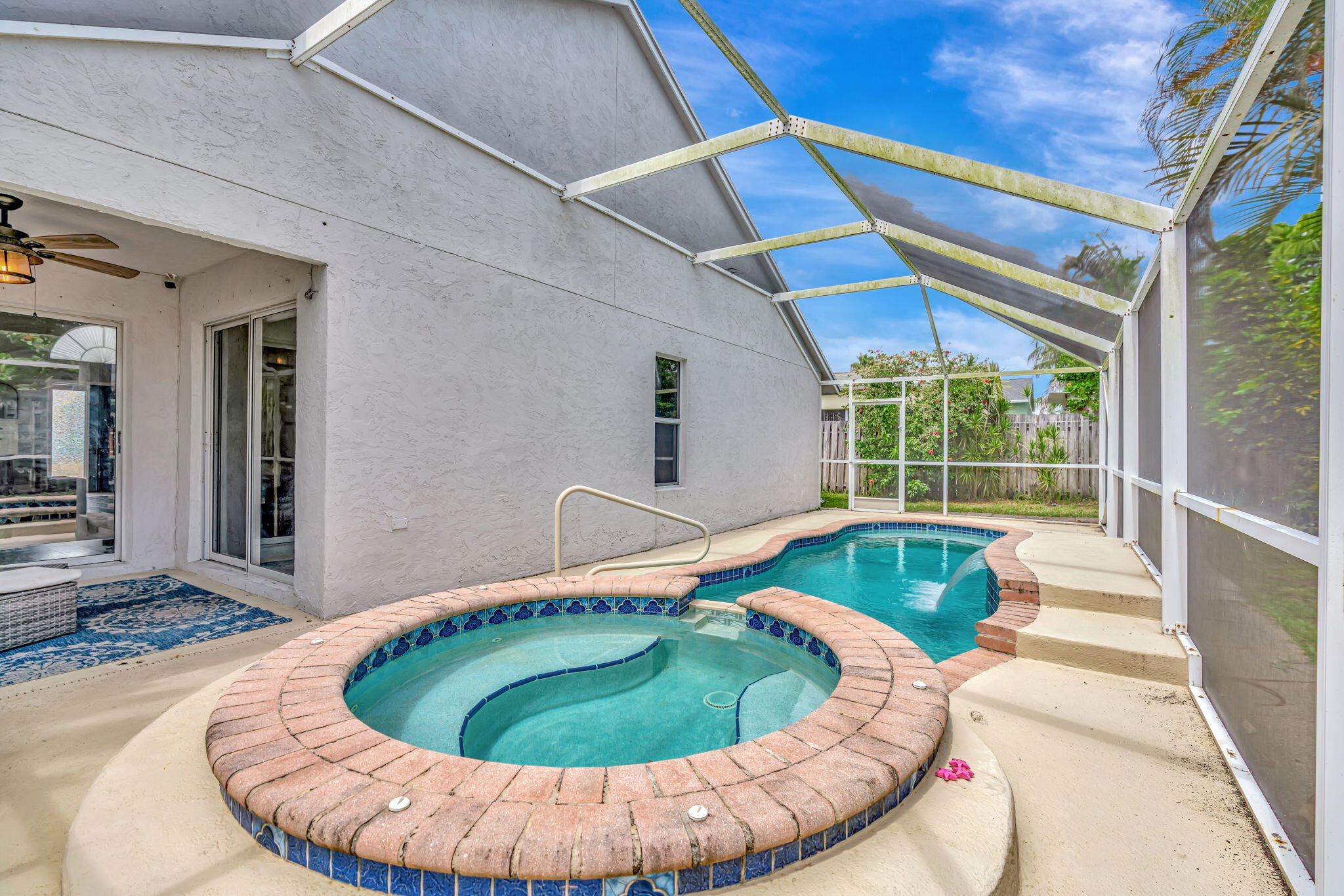 6247 Ungerer Street Jupiter, FL 33458 - Photo 33 of 36 a small pool with outdoor seating
