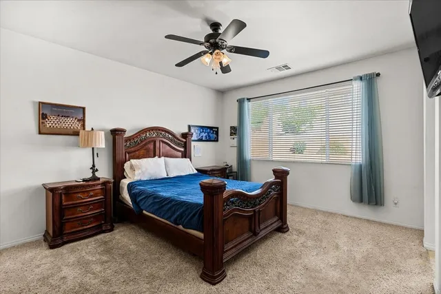 a bedroom with a bed and window