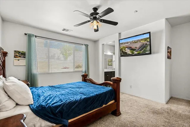 a bathroom with a tub double sink window and mirror