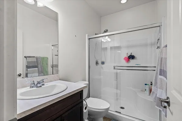 a kitchen with stainless steel appliances granite countertop a refrigerator and a stove