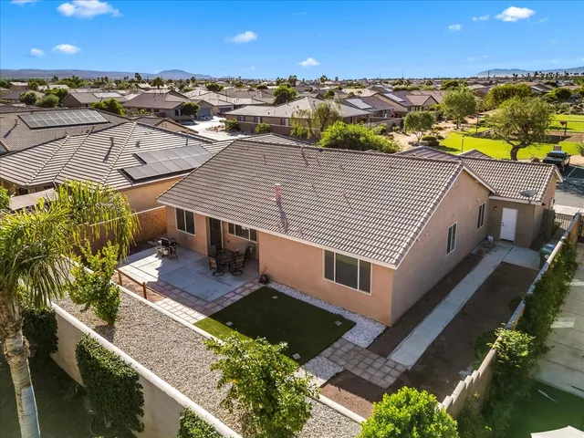 an aerial view of a house with a ocean view