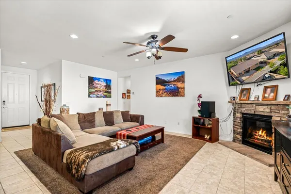 a living room with furniture and a fireplace