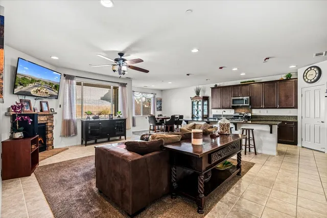a living room with fireplace furniture and a flat screen tv