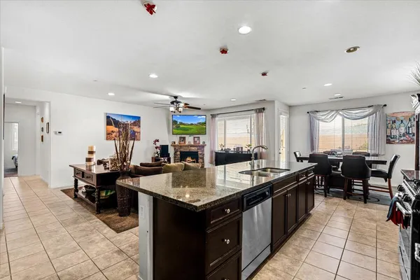 a large kitchen with lots of counter space and windows