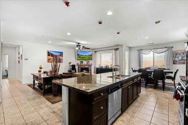 a large kitchen with lots of counter space and windows