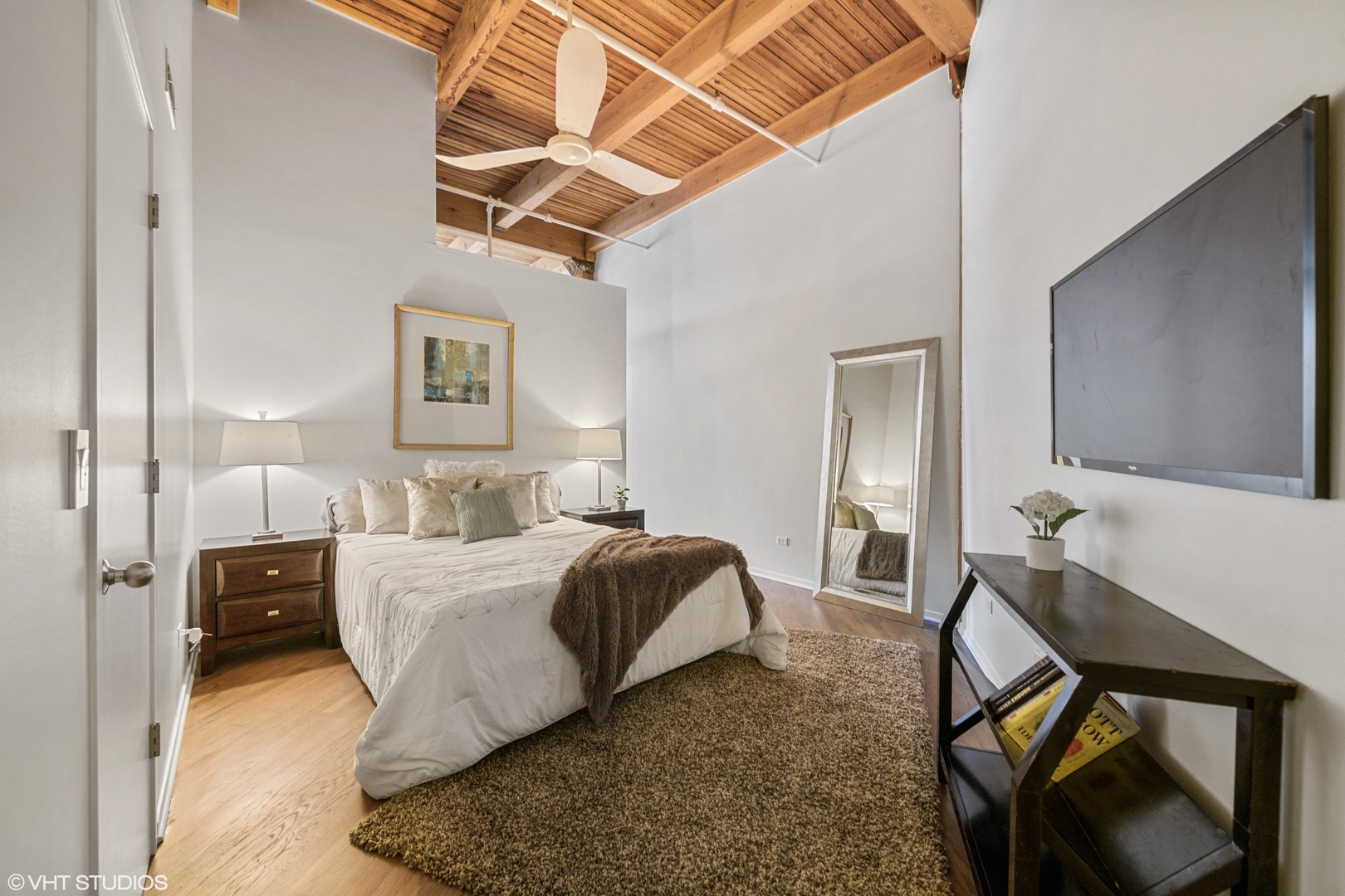 616 West Fulton Street, Unit 408 Chicago, IL 60661 - Photo 11 of 14 a bed room with a bed and a couch
