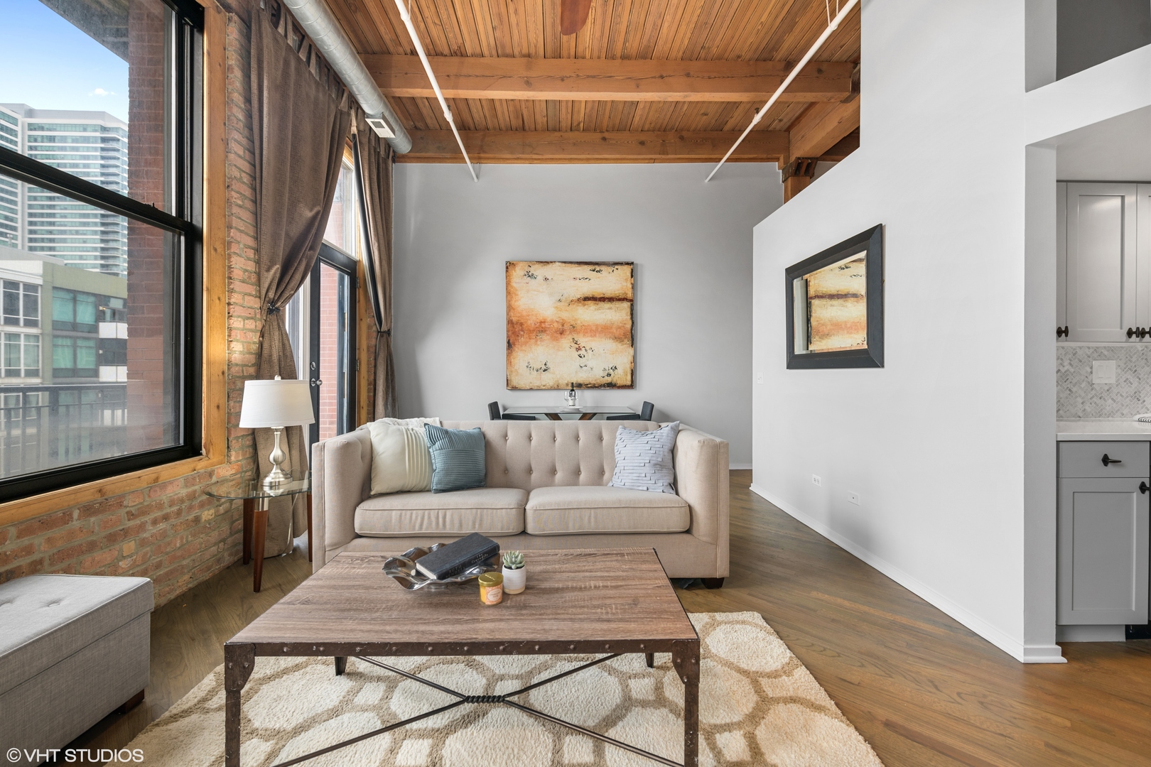 616 West Fulton Street, Unit 408 Chicago, IL 60661 - Photo 4 of 14 a living room with furniture and a floor to ceiling window