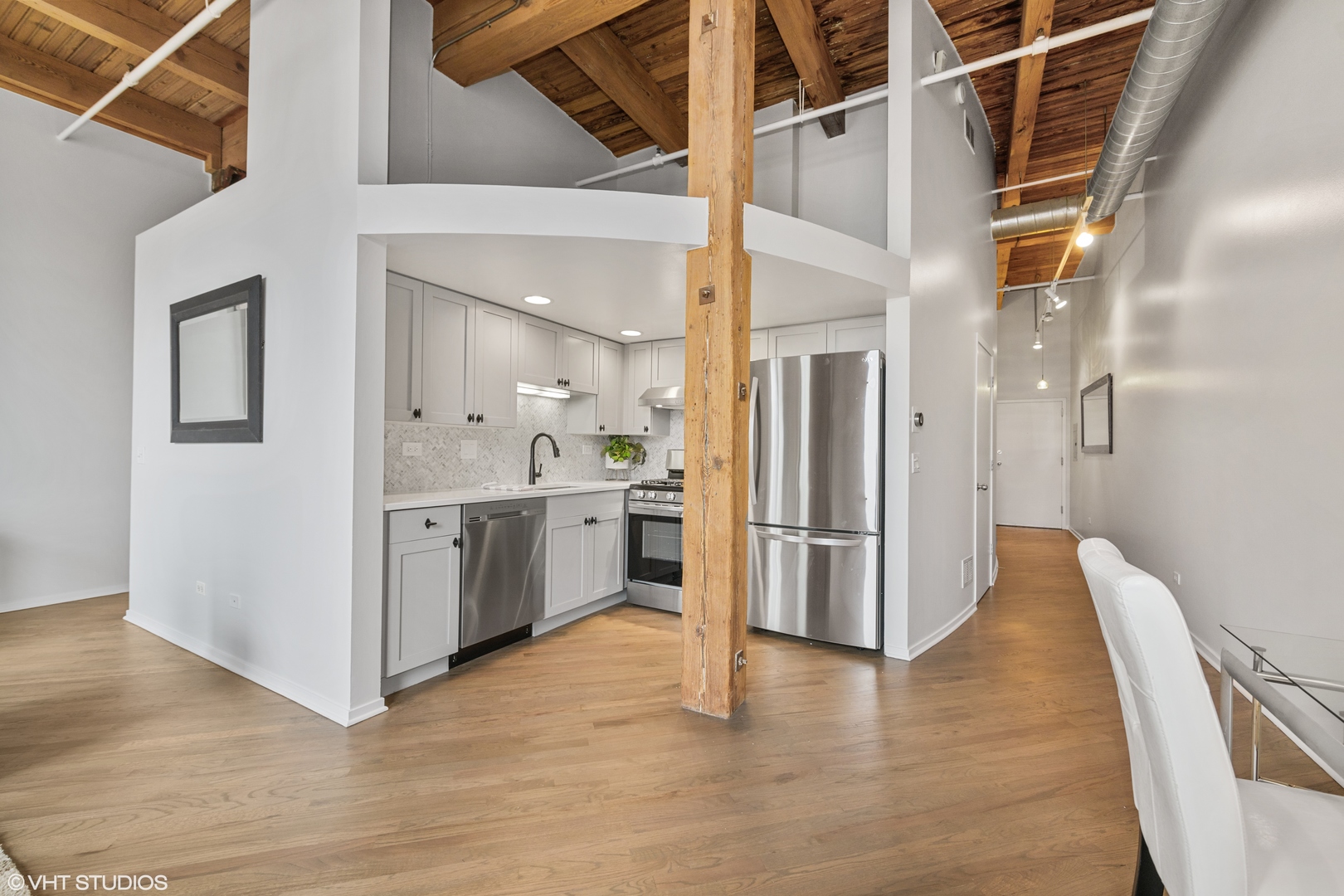 616 West Fulton Street, Unit 408 Chicago, IL 60661 - Photo 7 of 14 a view of a kitchen cabinets and wooden floor