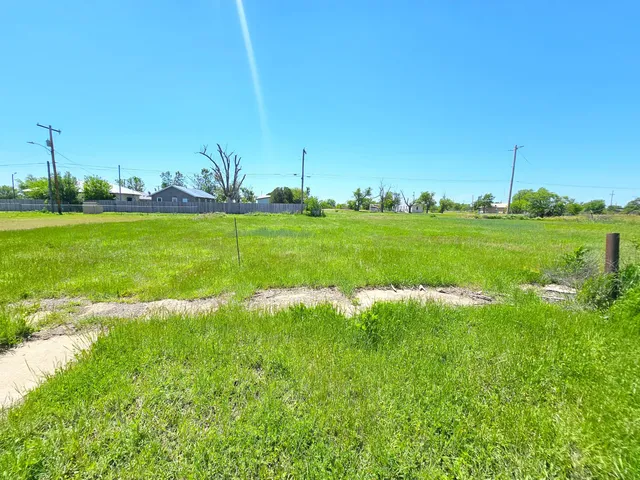 a view of a golf course with a lake