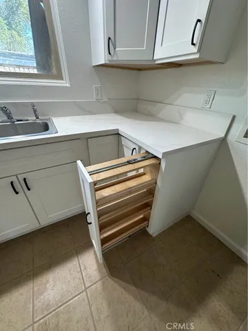 a kitchen with a sink and cabinets