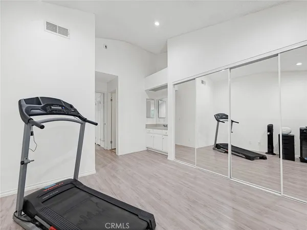 a view of a room with wooden floor
