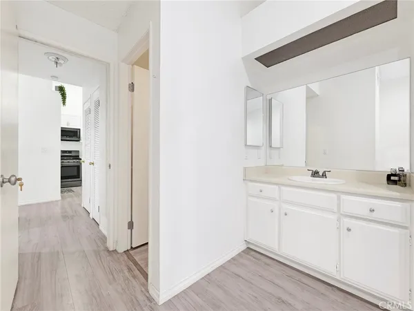 a bathroom with a double vanity sink and mirror