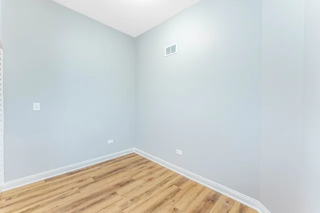 a view of room with wooden floor