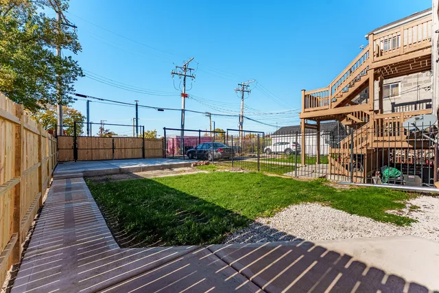 a view of a backyard with sitting area