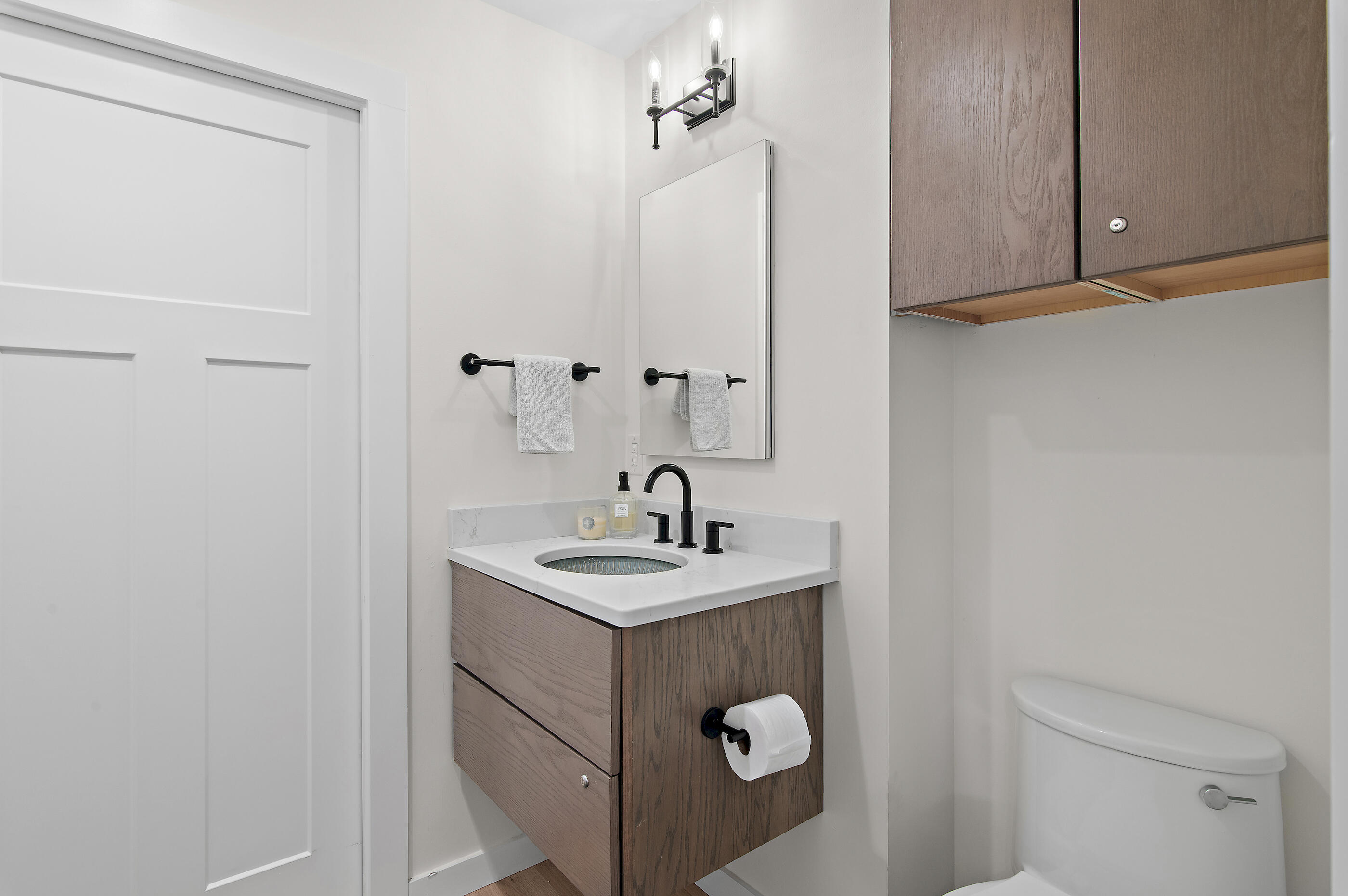 255 Blue Mountain Road, Unit 8 Santa Rosa Beach, FL 32459 - Photo 11 of 53 a bathroom with a sink and mirror