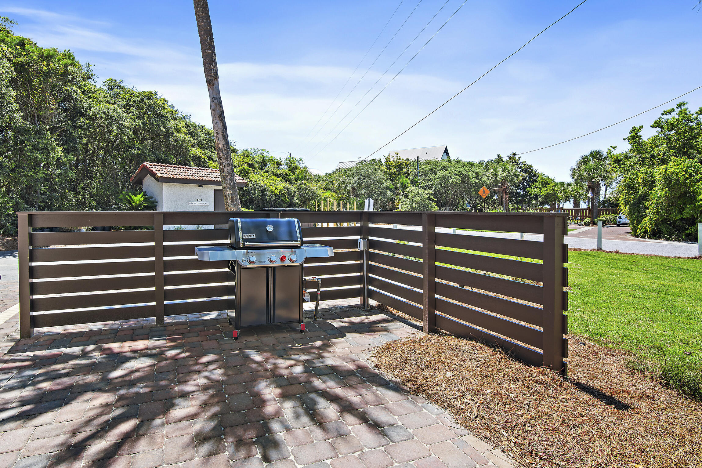255 Blue Mountain Road, Unit 8 Santa Rosa Beach, FL 32459 - Photo 16 of 53 a view of a bench in the garden