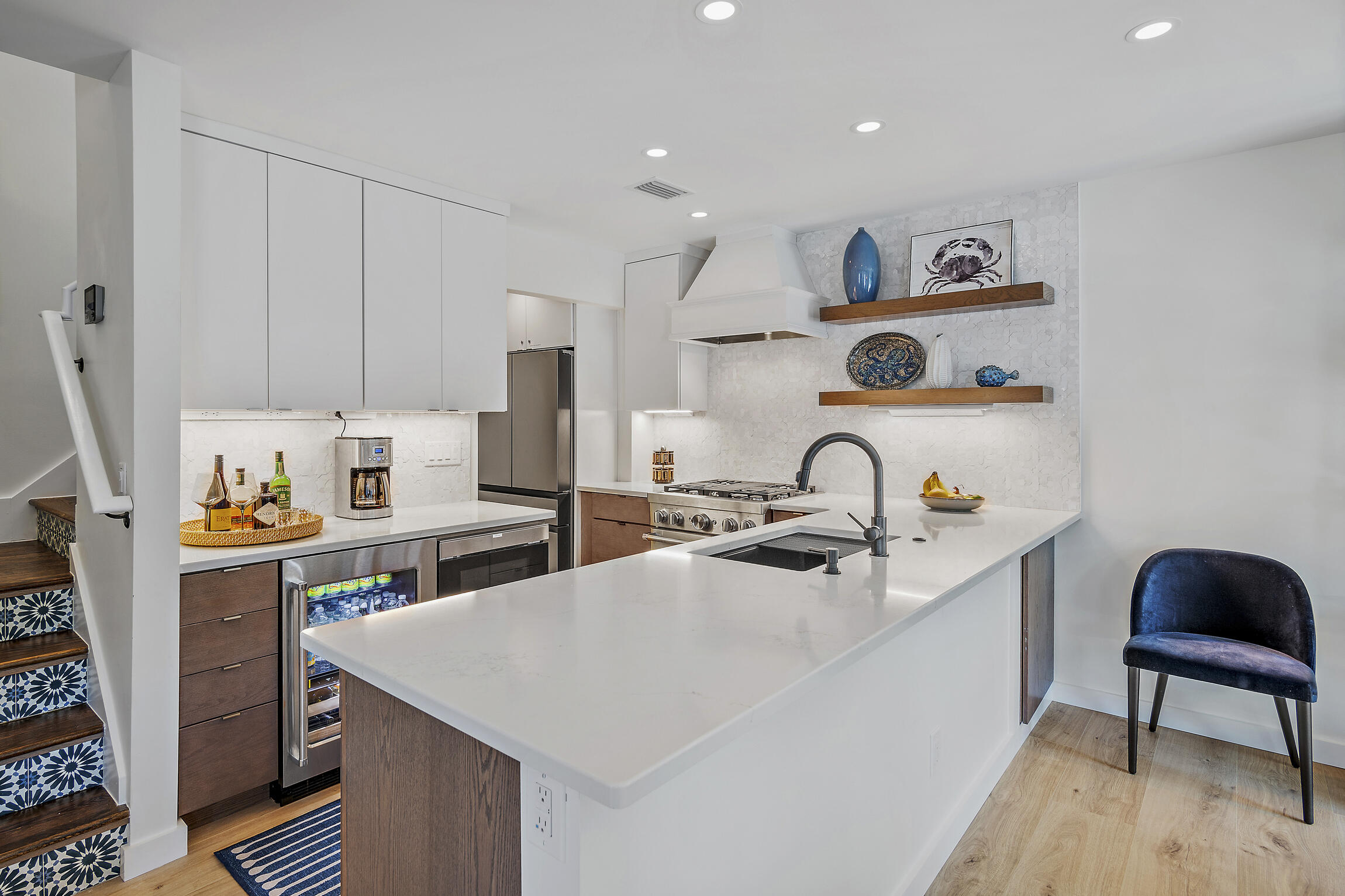 255 Blue Mountain Road, Unit 8 Santa Rosa Beach, FL 32459 - Photo 18 of 53 a open kitchen with stainless steel appliances granite countertop a table chairs in it and wooden floors