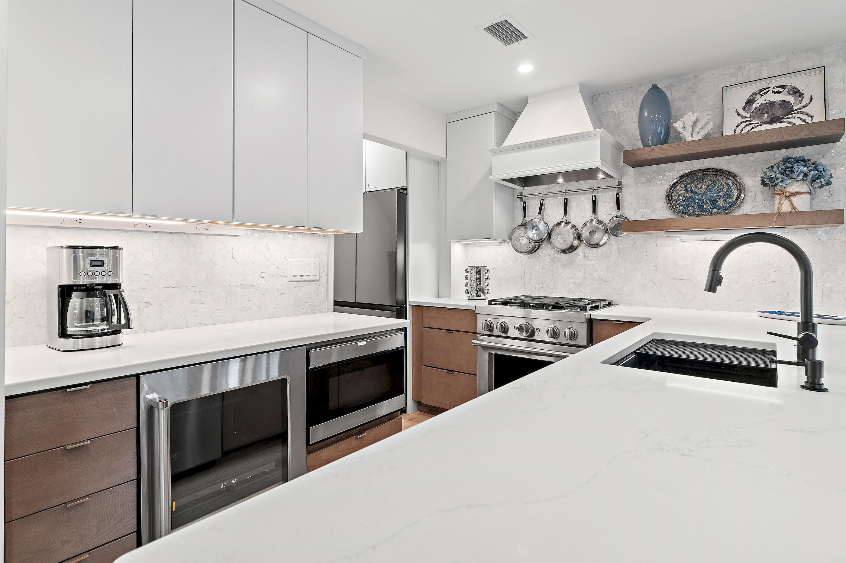 255 Blue Mountain Road, Unit 8 Santa Rosa Beach, FL 32459 - Photo 22 of 53 a kitchen with stainless steel appliances kitchen island a sink stove and cabinets