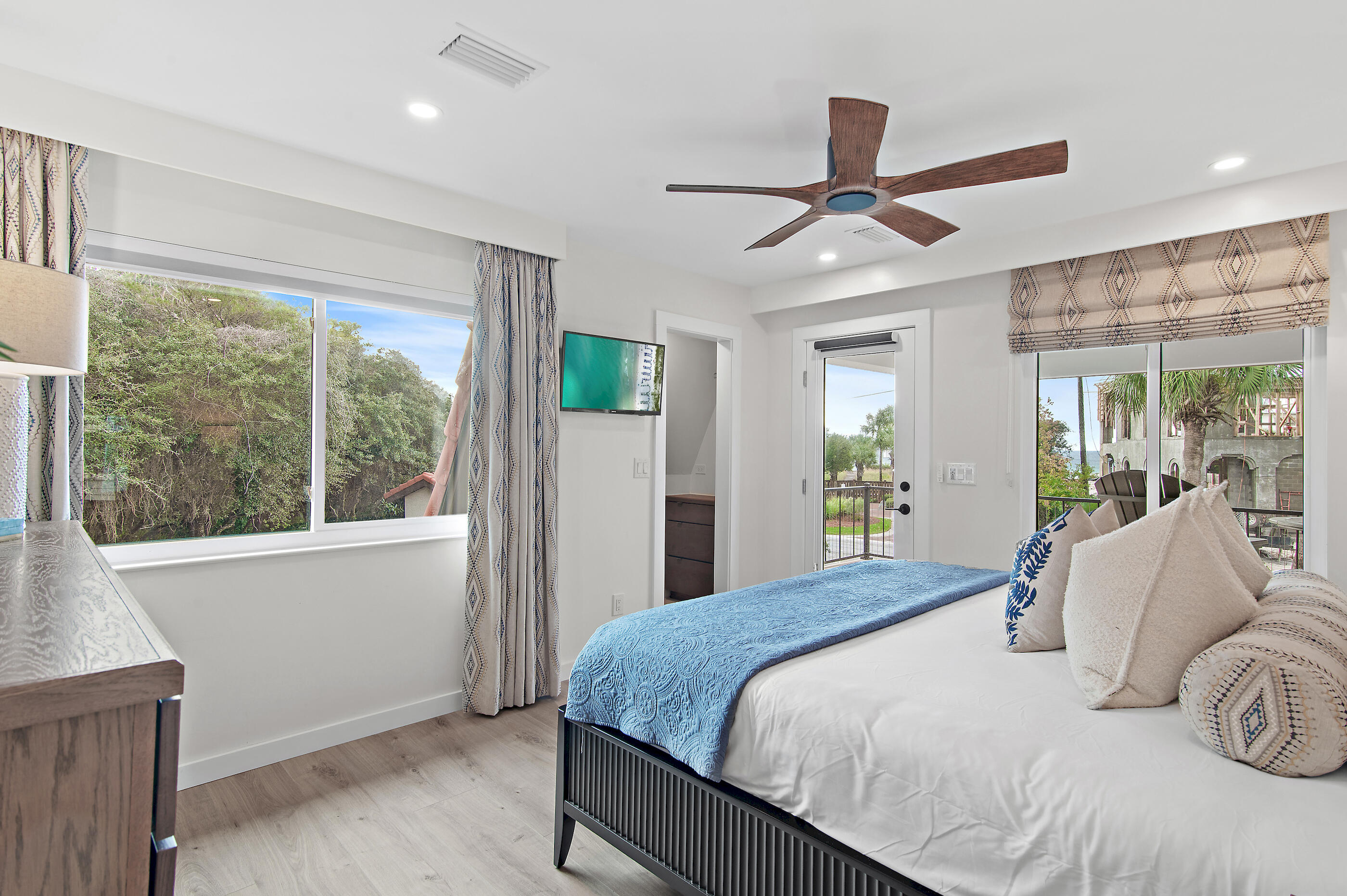 255 Blue Mountain Road, Unit 8 Santa Rosa Beach, FL 32459 - Photo 29 of 53 a bedroom with a large bed and a large window