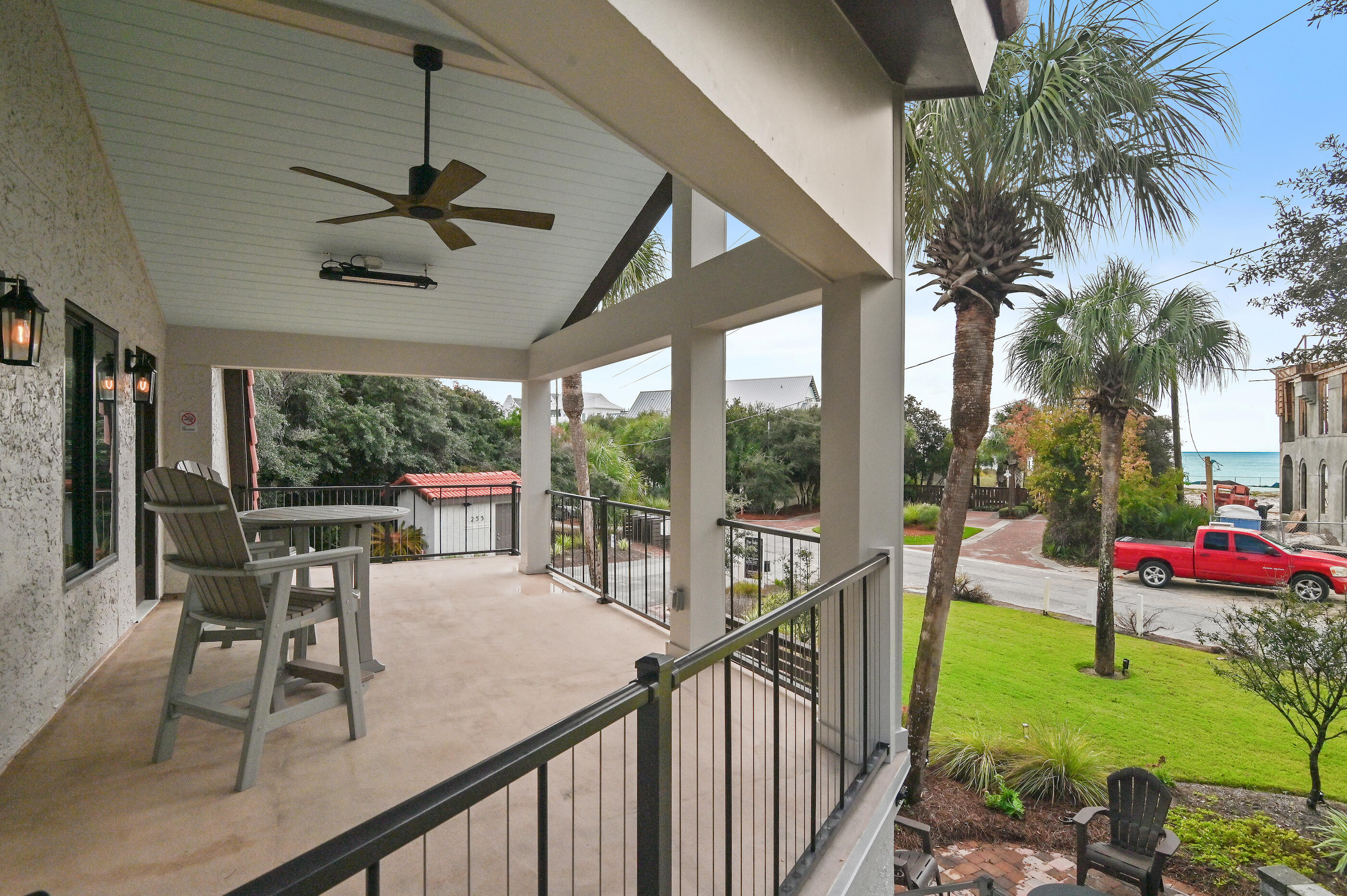 255 Blue Mountain Road, Unit 8 Santa Rosa Beach, FL 32459 - Photo 33 of 53 a view of a patio with couches and table and chairs and potted plants