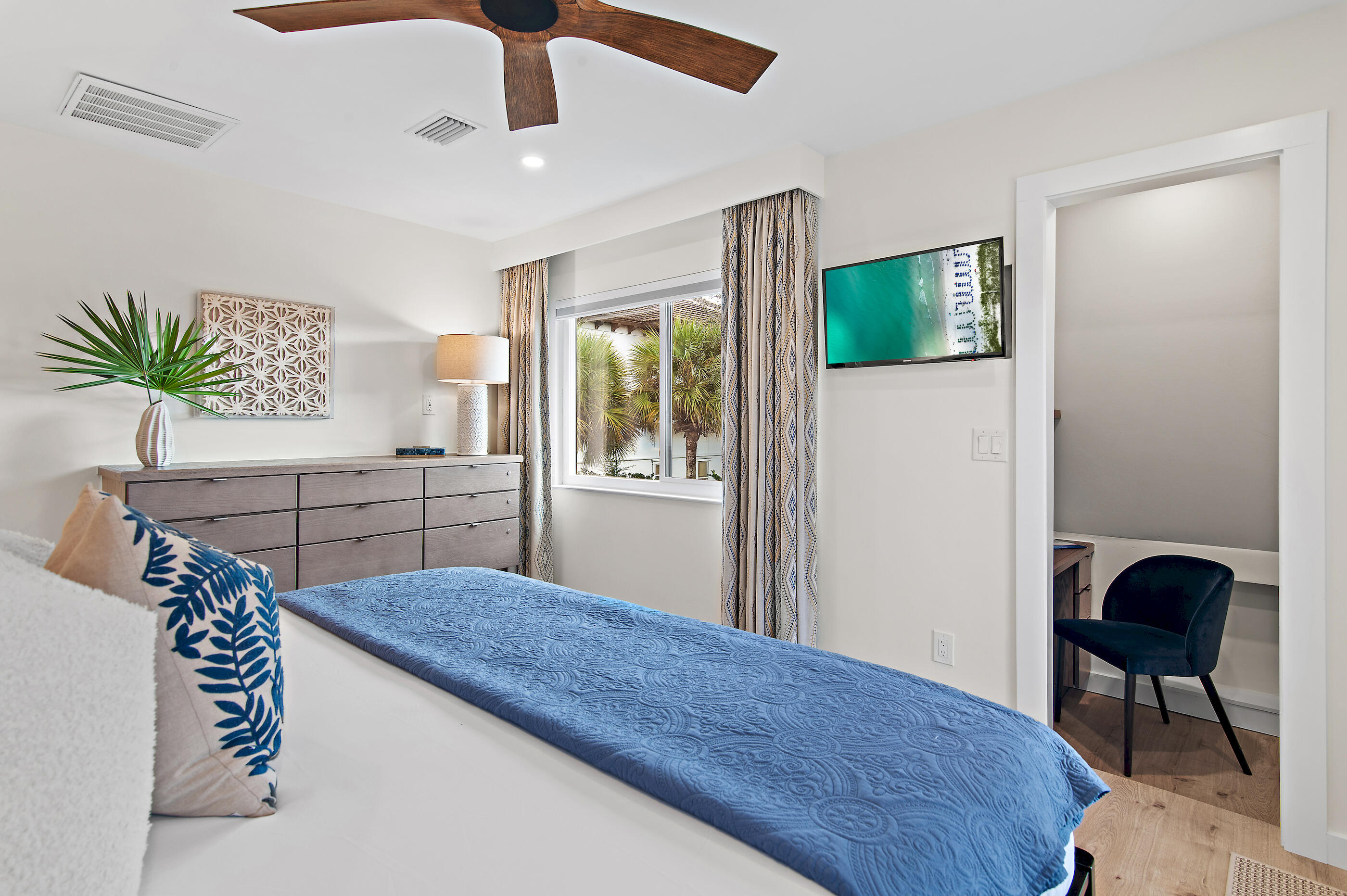 255 Blue Mountain Road, Unit 8 Santa Rosa Beach, FL 32459 - Photo 39 of 53 a bedroom with a bed and a potted plant